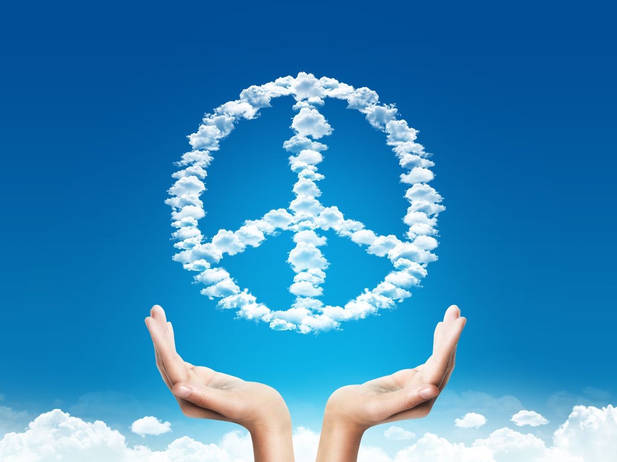 Hand save or protection peace sign shaped clouds over blue background. protection  concept. peace concept.
