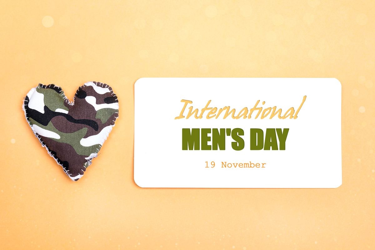 International men's day background with military heart on yellow backdrop.