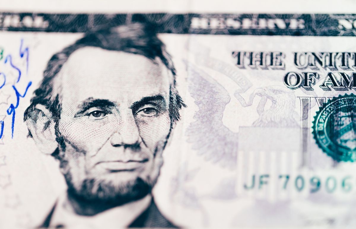 US dollars $5 dollar bill note with the face of president Abraham Lincoln.