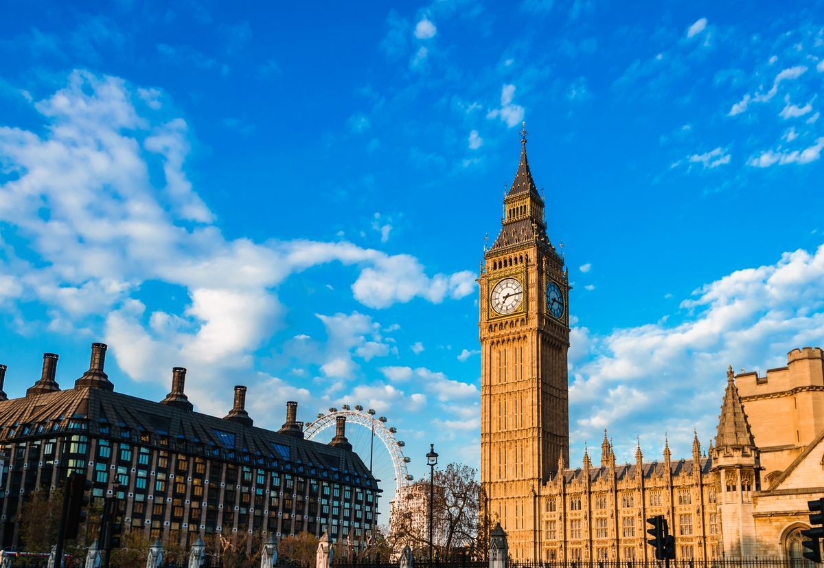 Big Ben in London UK United Kingdom on gorgeous blue sky background at sunny summer day