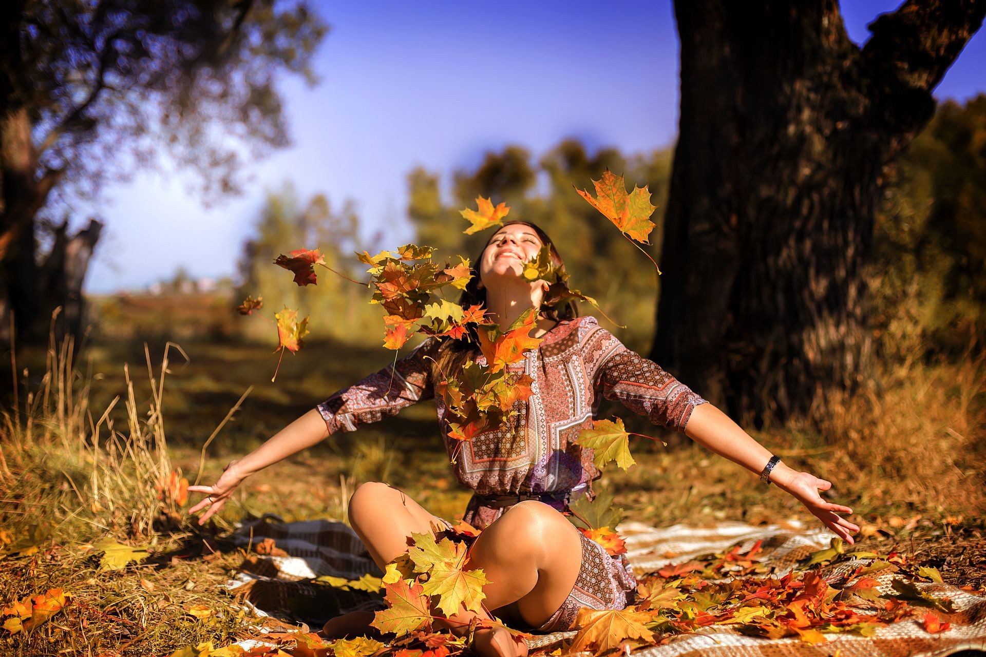 the girl close up in autumn foliage