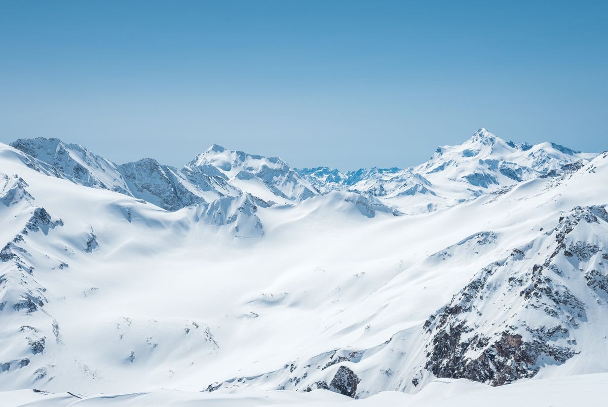 Winter snow covered mountain peaks in Caucasus. Great place for winter sports