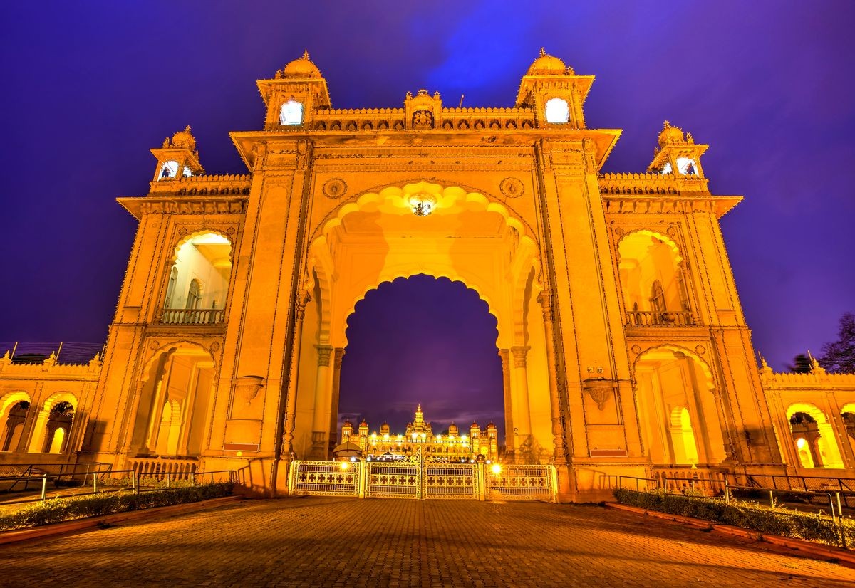 Majestic entrance to Mysore Palace seen at the blue hour, Karnataka, South India.