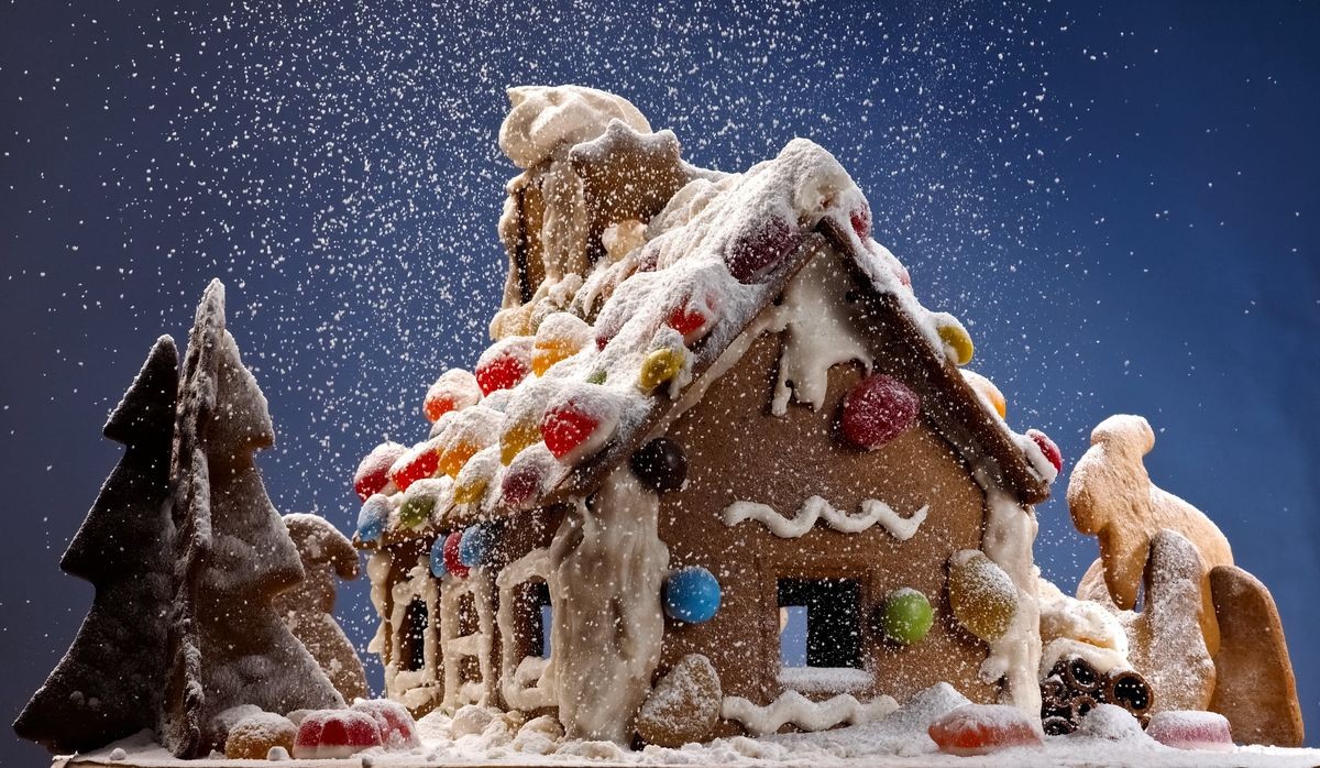 Ginger bread house with snowfal in the night