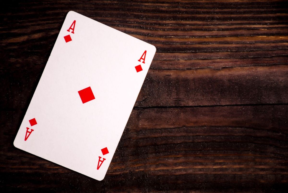 Playing card - ace - on a wood table