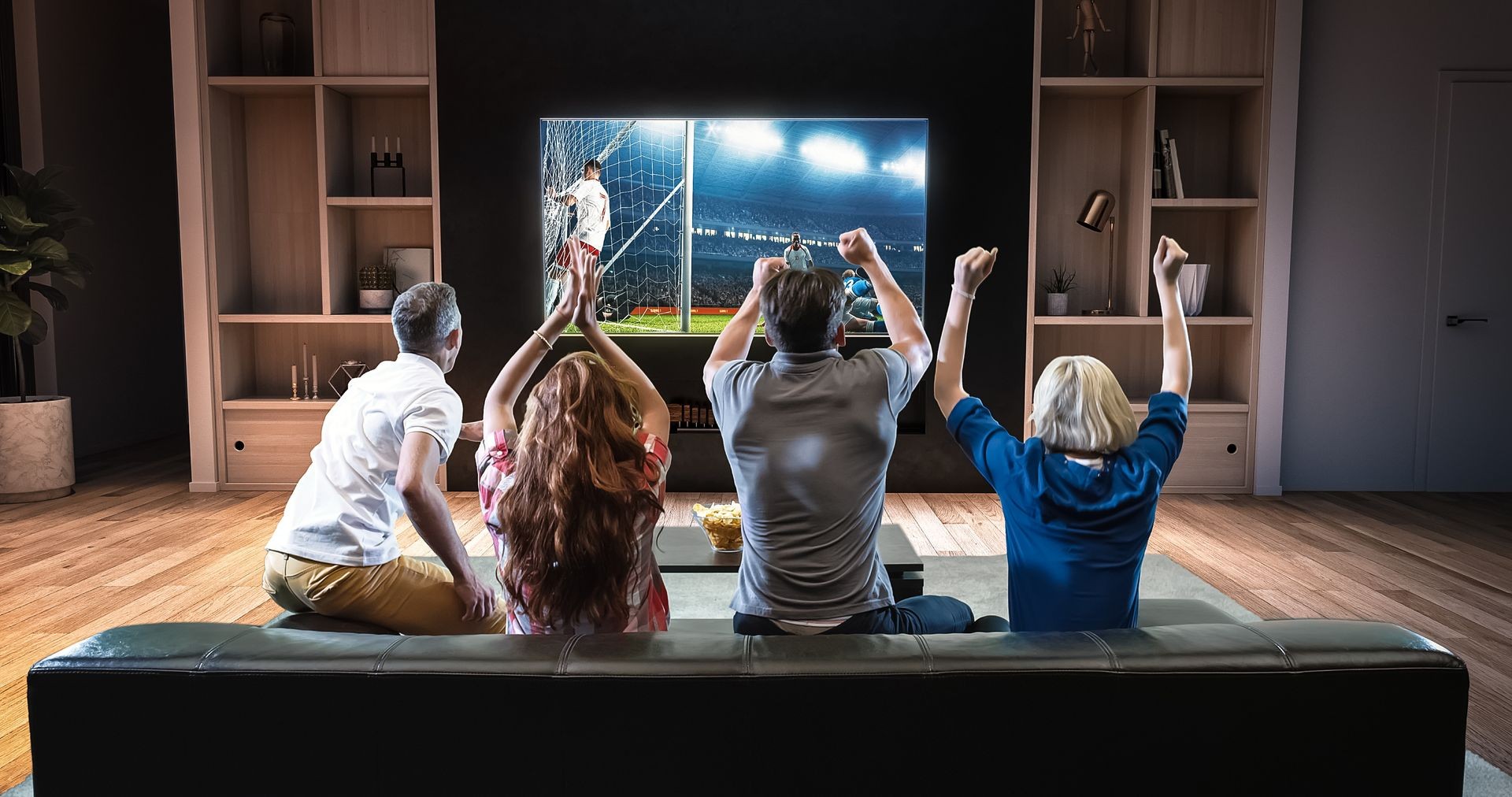 Group of students are watching a soccer moment on the TV and celebrating a goal, sitting on the couch in the living room. The living room is made in 3D.