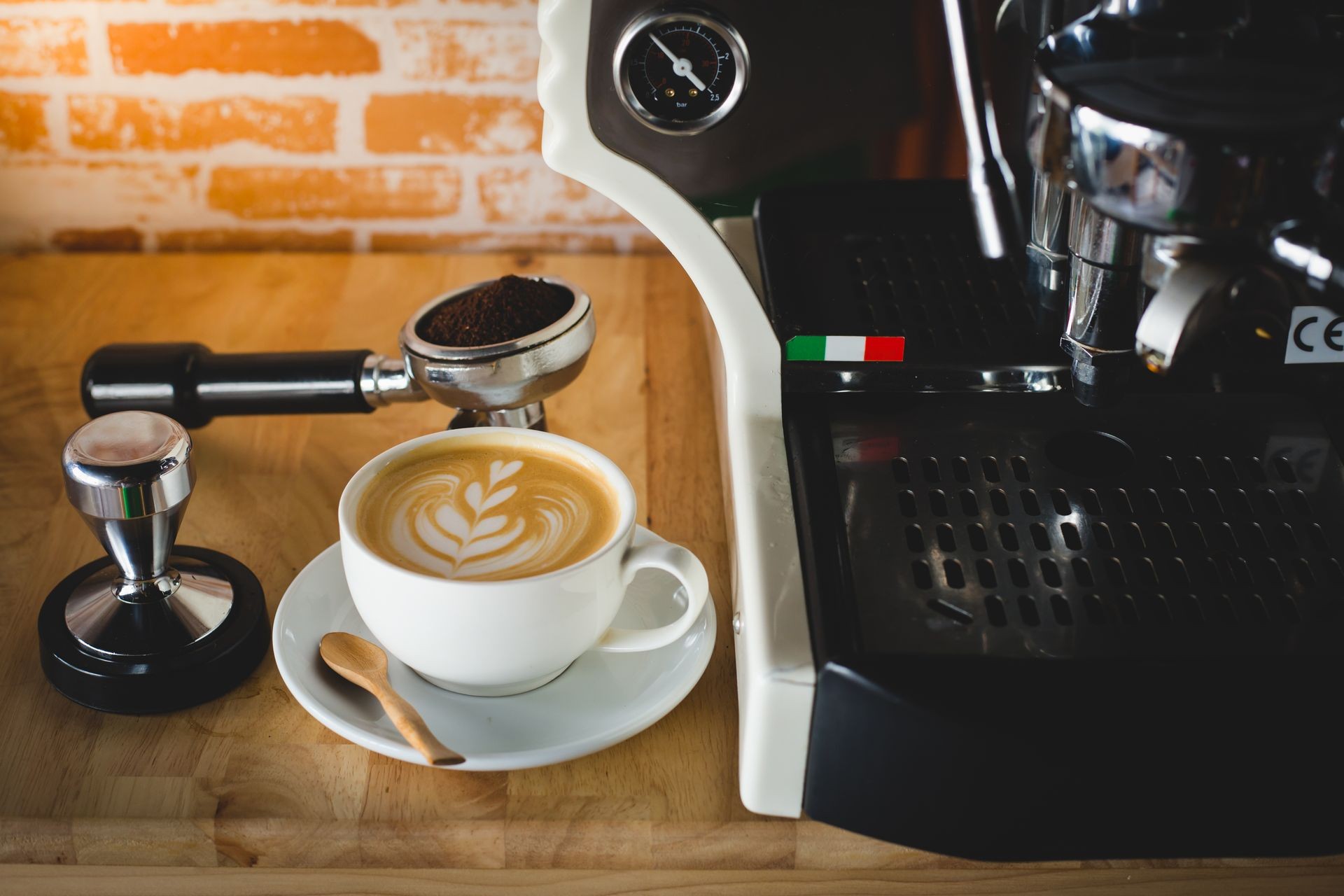 a cup of latte art are ready to serve from the espresso machine