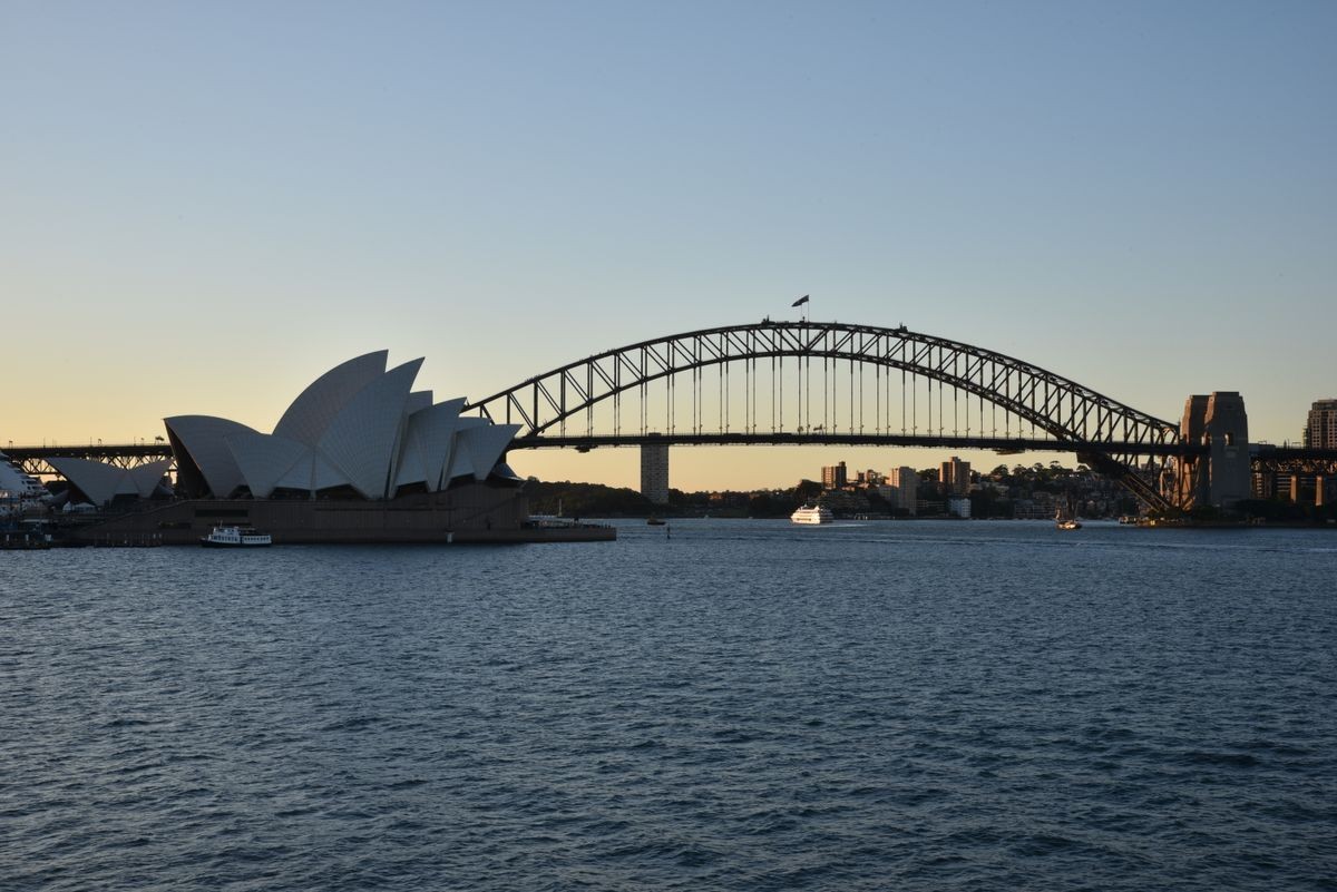 Night shot of Scenic Sydney Harbor and iconic Sydney Opera House and Harbor Bridge Landmarks