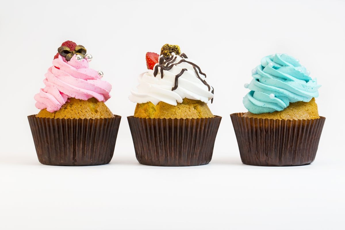 cakes with cream on a white background