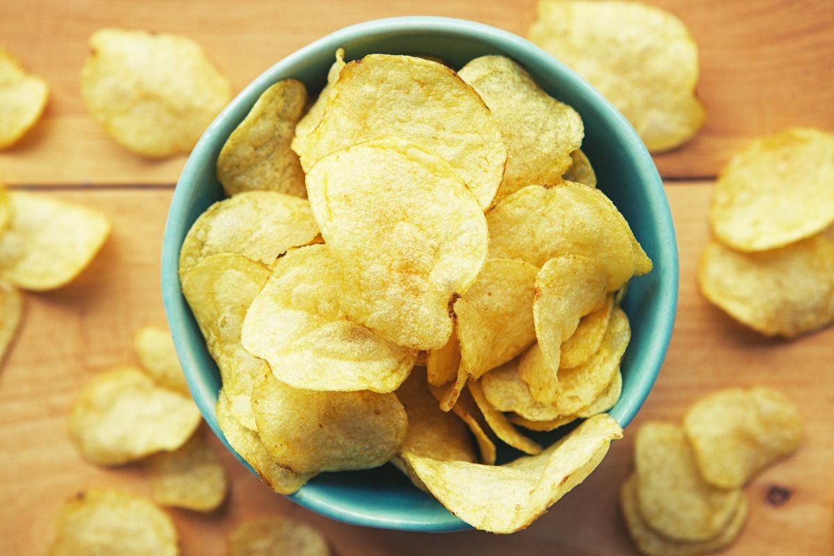 fast food, potato chips in ceramic bowl