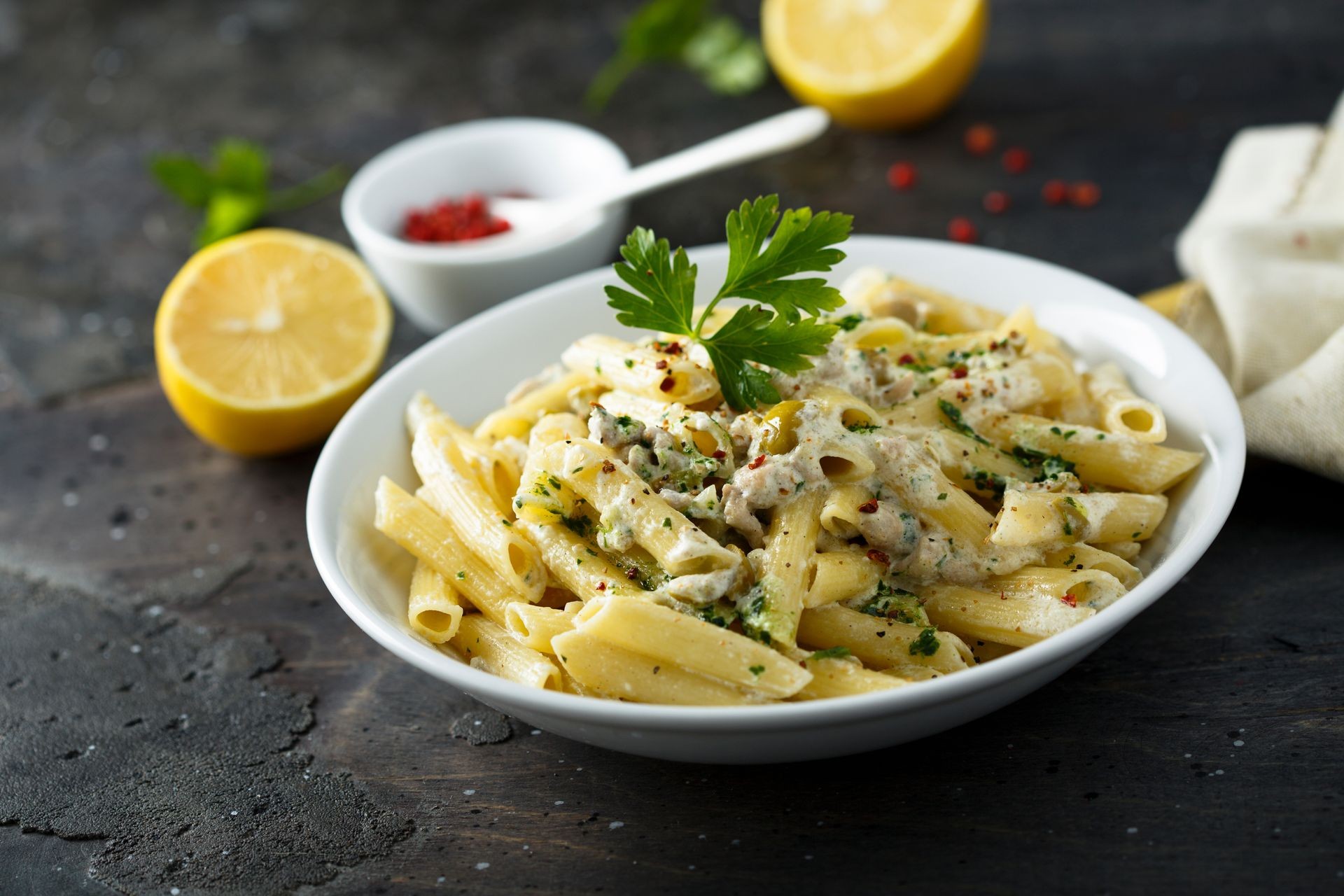 Cream sauce pasta with olives and meat