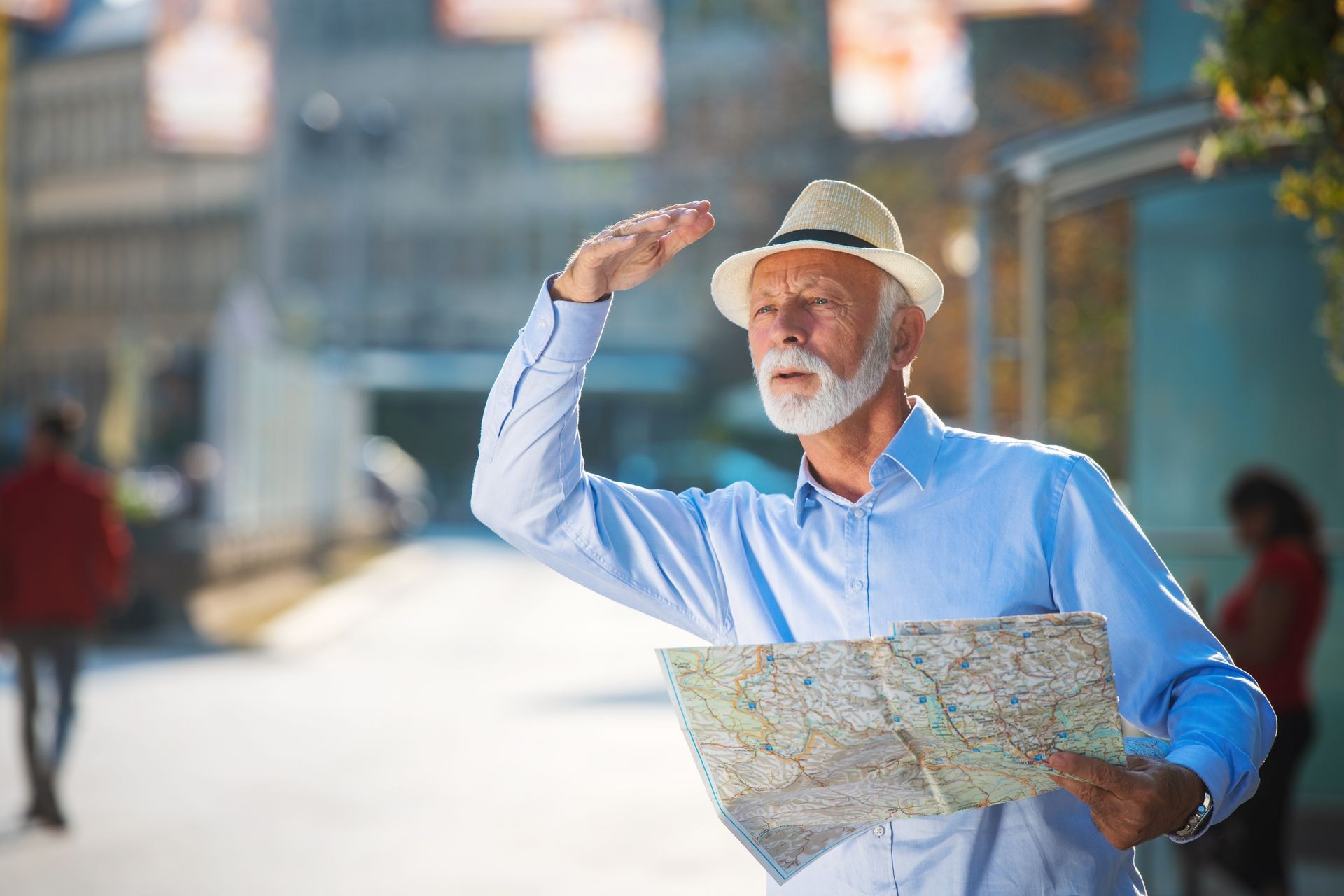 Happy smiling elder man tourist ready for journey, looking for direction.