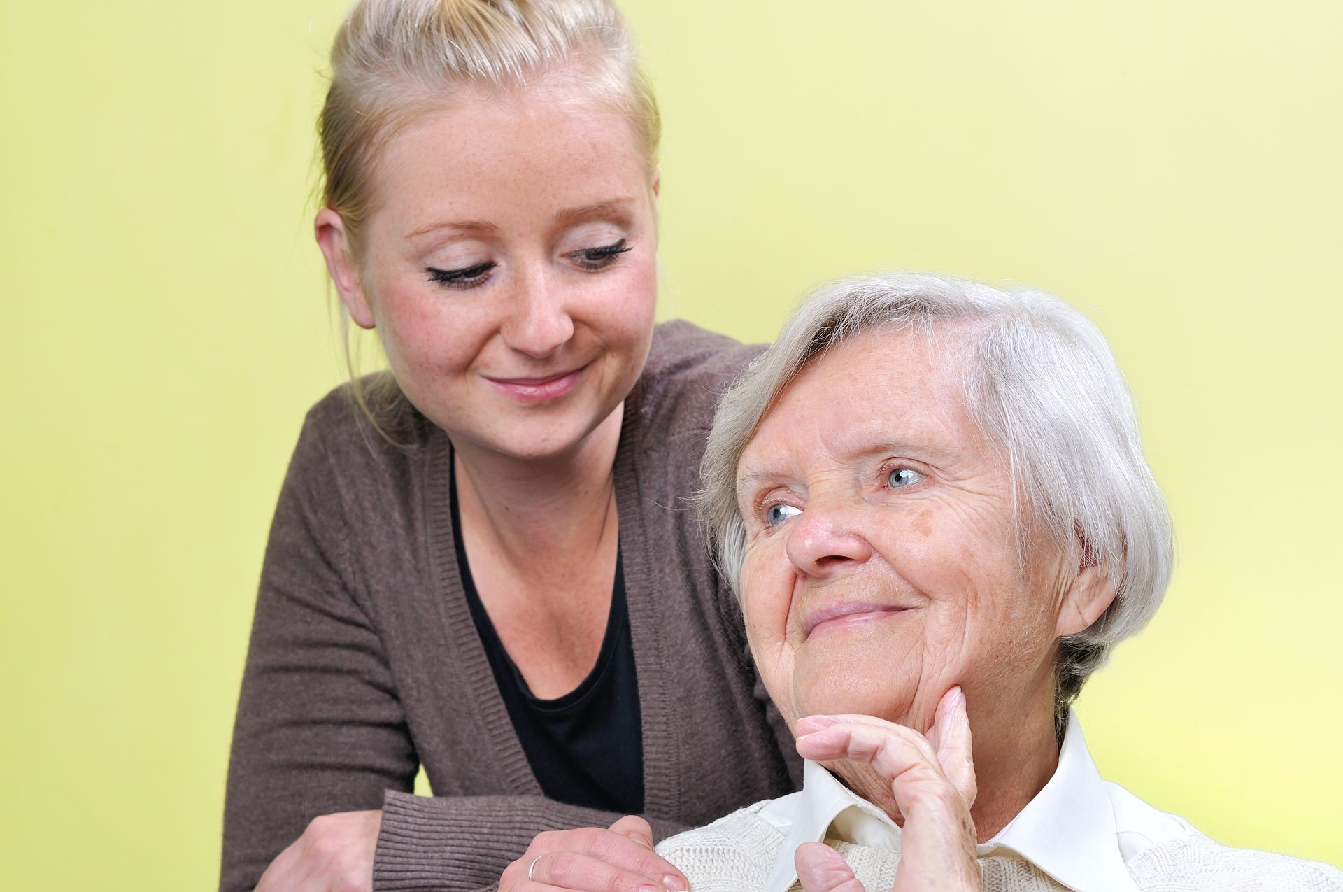 Senior woman with her caregiver.  Happy and smiling.